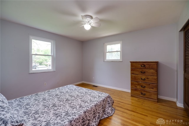200 S Village, Washington Twp, OH 45459 - bedroom with light wood finished floors, baseboards, a closet, and ceiling fan