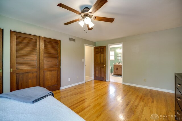 200 S Village, Washington Twp, OH 45459 - bedroom featuring baseboards, light wood-type flooring, ceiling fan, and ensuite bathroom
