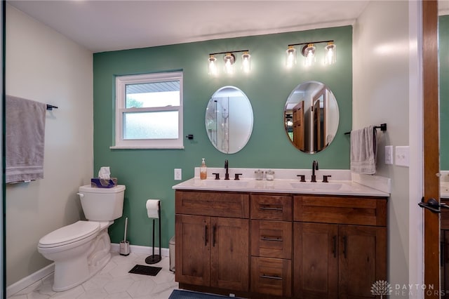 200 S Village, Washington Twp, OH 45459 - bathroom with toilet, double vanity, baseboards, and tile patterned flooring