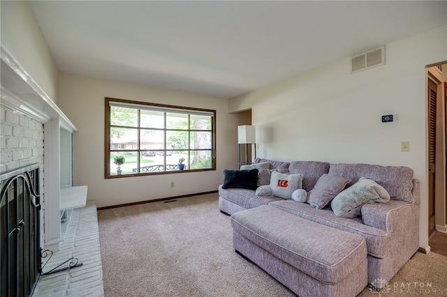 200 S Village, Washington Twp, OH 45459 - living room with light colored carpet, baseboards, and a fireplace