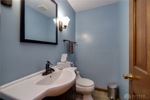 200 S Village, Washington Twp, OH 45459 - half bath featuring toilet, baseboards, vanity, and tile patterned floors