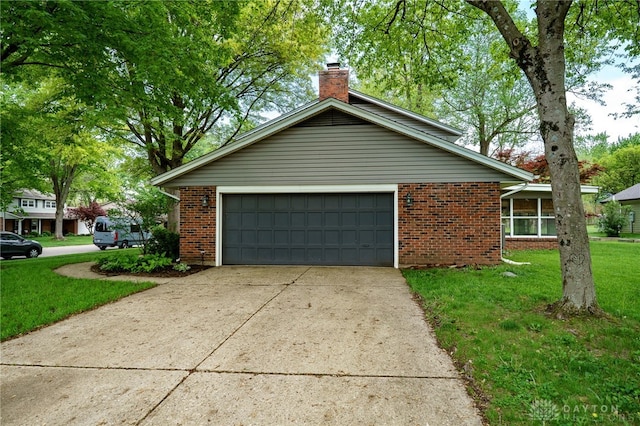 200 S Village, Washington Twp, OH 45459 - view of side of property featuring brick siding, driveway, a chimney, a yard, and an attached garage