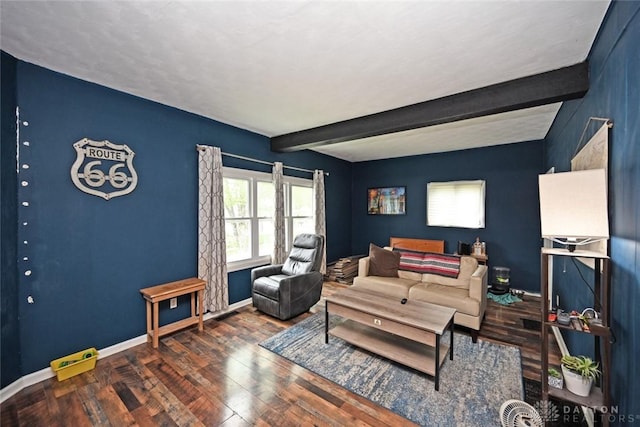 living room with wood finished floors, beamed ceiling, and baseboards