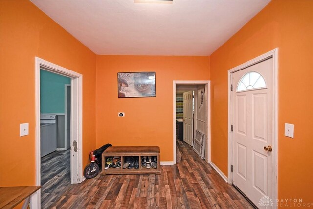 foyer with wood finished floors and baseboards
