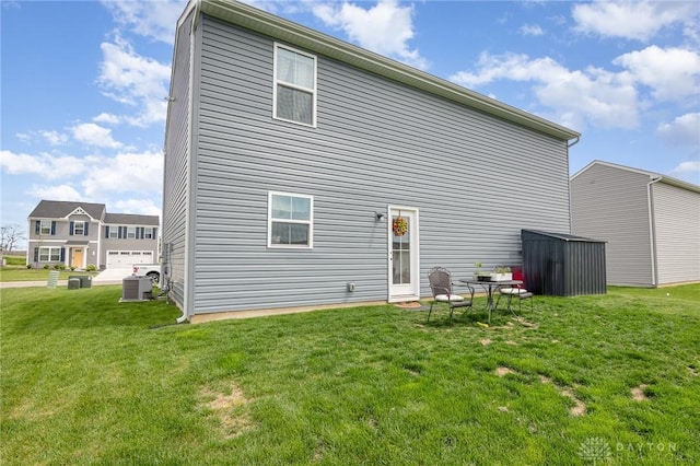 100 Whitney Way, West Milton, OH 45383 - back of house with central AC and a yard