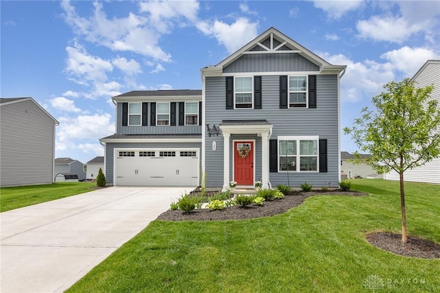 100 Whitney Way, West Milton, OH 45383 - view of front of home with board and batten siding, driveway, a front lawn, and an attached garage