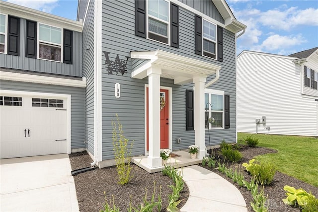 100 Whitney Way, West Milton, OH 45383 - view of front of home featuring board and batten siding and an attached garage