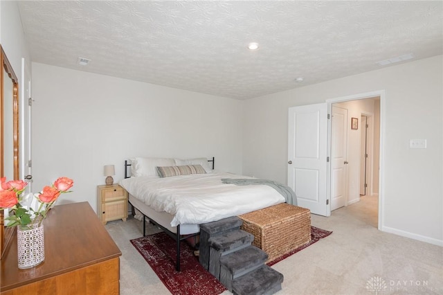 100 Whitney Way, West Milton, OH 45383 - bedroom featuring light carpet, baseboards, a textured ceiling, and recessed lighting