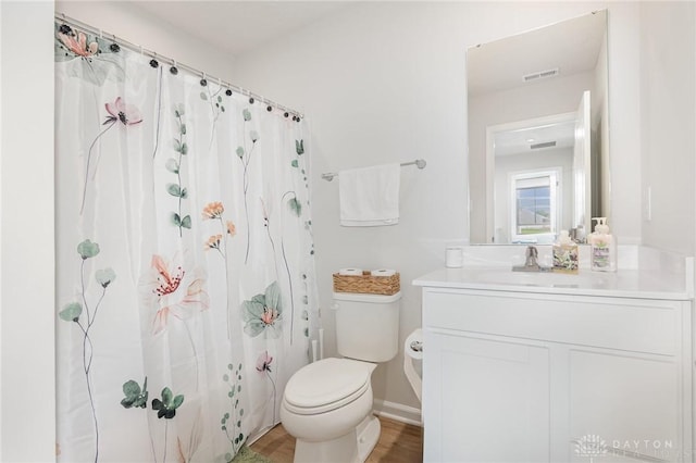 100 Whitney Way, West Milton, OH 45383 - full bath with toilet, vanity, curtained shower, and wood finished floors