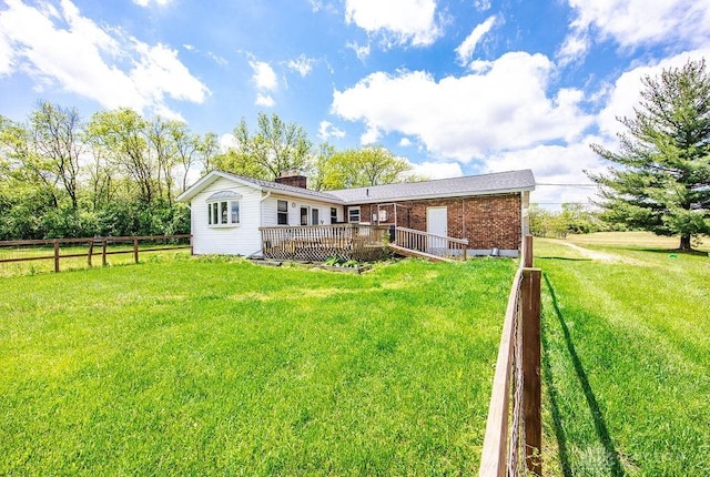 2774 N Law Rd, Oxford, OH 45056 - rear view of house featuring brick siding, a wooden deck, and a chimney