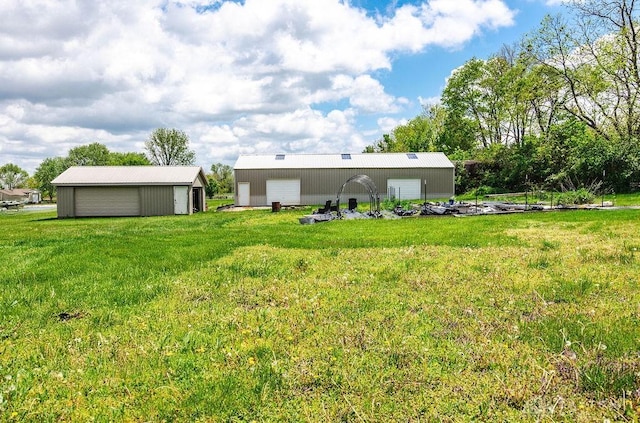 2774 N Law Rd, Oxford, OH 45056 - back of property featuring a detached garage, a yard, an outdoor structure, and an outbuilding