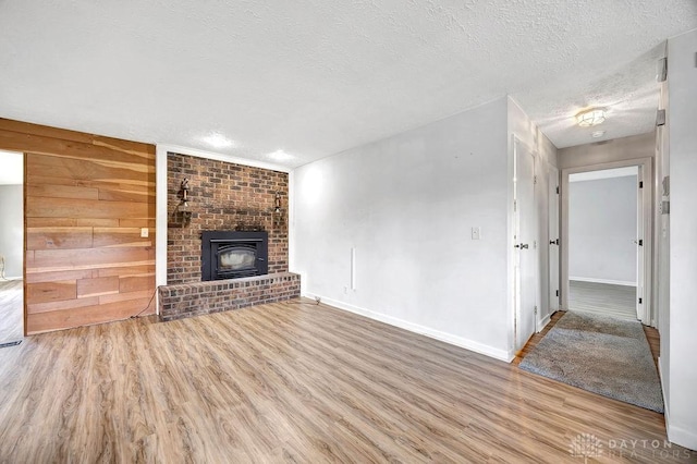 2774 N Law Rd, Oxford, OH 45056 - unfurnished living room featuring a textured ceiling, wood finished floors, and baseboards