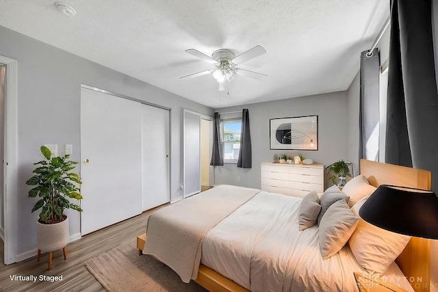 2774 N Law Rd, Oxford, OH 45056 - bedroom with wood finished floors, a ceiling fan, and baseboards