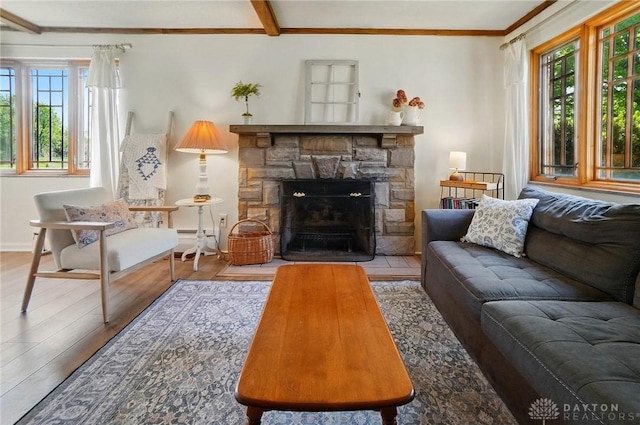 4207 Morningside Blvd, Dayton, OH 45432 - living area featuring plenty of natural light, wood finished floors, baseboard heating, baseboards, and ornamental molding