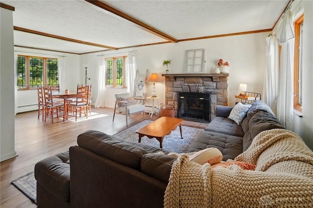 4207 Morningside Blvd, Dayton, OH 45432 - living room featuring baseboard heating, ornamental molding, wood finished floors, a textured ceiling, and beam ceiling