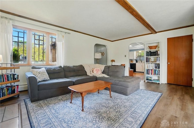 4207 Morningside Blvd, Dayton, OH 45432 - living area with arched walkways, wood finished floors, beamed ceiling, ornamental molding, and a baseboard radiator