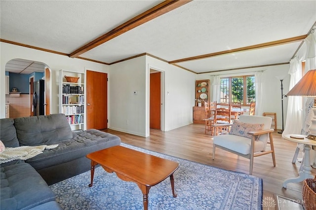 4207 Morningside Blvd, Dayton, OH 45432 - living room with arched walkways, light wood-type flooring, crown molding, beam ceiling, and a textured ceiling