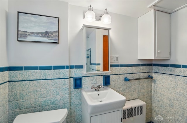 4207 Morningside Blvd, Dayton, OH 45432 - bathroom with toilet, tile walls, wainscoting, and vanity