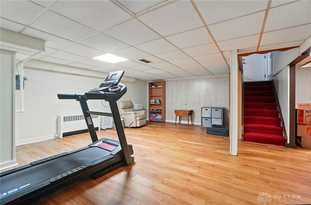 4207 Morningside Blvd, Dayton, OH 45432 - workout room featuring radiator, light wood-style flooring, baseboards, and a drop ceiling