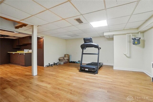 4207 Morningside Blvd, Dayton, OH 45432 - workout room featuring a drop ceiling, light wood-type flooring, and baseboards