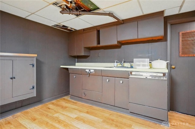4207 Morningside Blvd, Dayton, OH 45432 - kitchen featuring dishwashing machine, a sink, light wood finished floors, light countertops, and open shelves