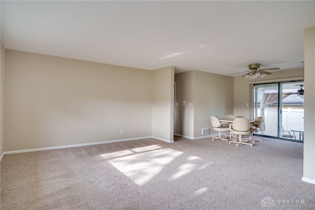4231 Maricarr Dr, Dayton, OH 45429 - living area featuring carpet flooring, baseboards, and a ceiling fan