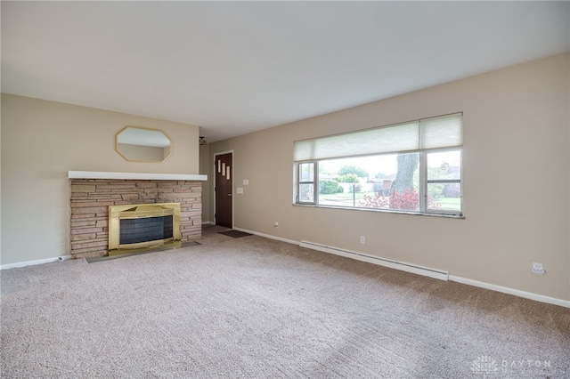 4231 Maricarr Dr, Dayton, OH 45429 - unfurnished living room featuring a baseboard heating unit, baseboards, carpet floors, and a stone fireplace
