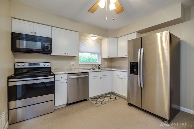 4231 Maricarr Dr, Dayton, OH 45429 - kitchen featuring appliances with stainless steel finishes, a sink, white cabinetry, and ceiling fan