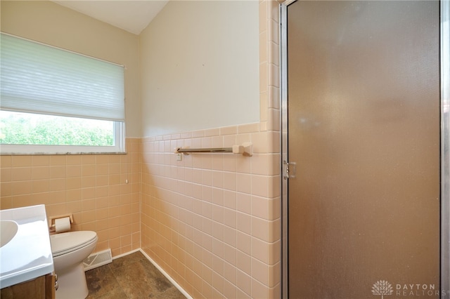 4231 Maricarr Dr, Dayton, OH 45429 - full bath with tile walls, a shower stall, toilet, vanity, and wainscoting