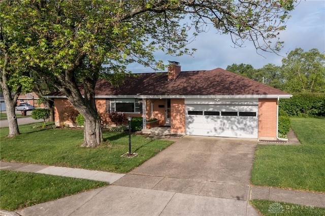 4231 Maricarr Dr, Dayton, OH 45429 - ranch-style home with brick siding, an attached garage, a front yard, a chimney, and concrete driveway