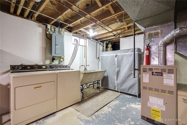 4231 Maricarr Dr, Dayton, OH 45429 - unfinished below grade area with electric panel, washer and dryer, and a sink