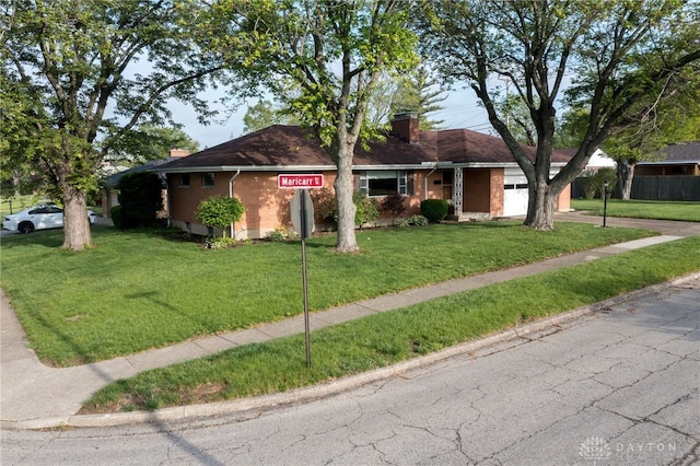 4231 Maricarr Dr, Dayton, OH 45429 - ranch-style home featuring a chimney, a front lawn, brick siding, and a garage