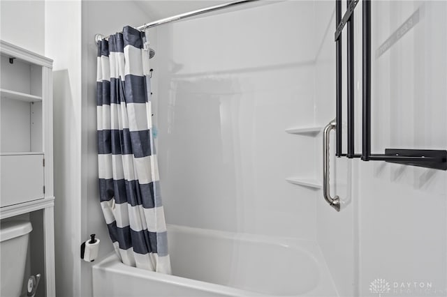 full bathroom with shower / bathtub combination with curtain and toilet