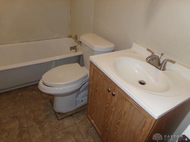 1719 Lamberton St, Middletown, OH 45044 - bathroom with toilet, vanity, and tile patterned flooring