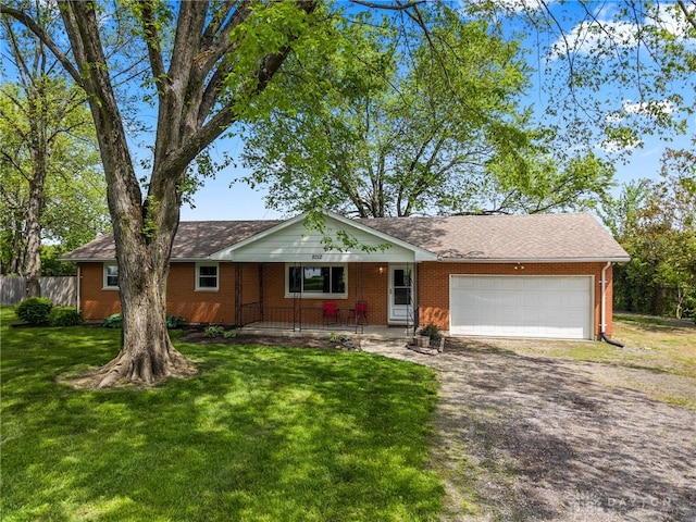 ranch-style house featuring driveway, brick siding, an attached garage, and a porch