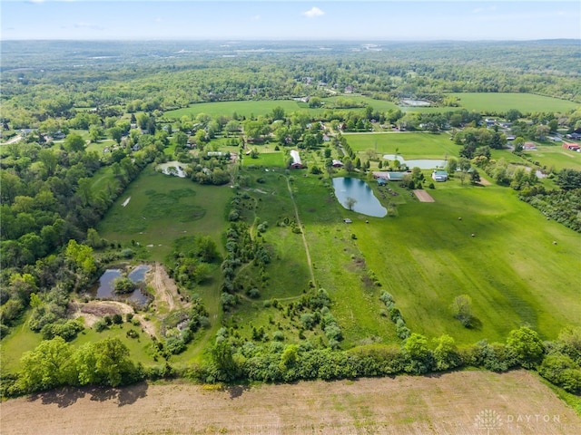 aerial view of property and surrounding area with a nearby body of water