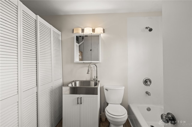 full bath featuring a closet, toilet, vanity, and shower / bathtub combination