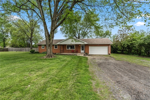 ranch-style home featuring an attached garage, dirt driveway, and brick siding