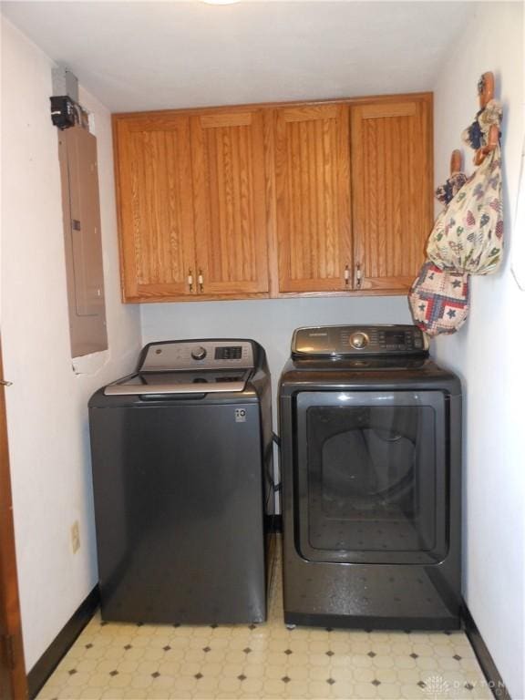 8189 Oakes Rd, Arcanum, OH 45304 - laundry area with independent washer and dryer, cabinet space, baseboards, light floors, and electric panel