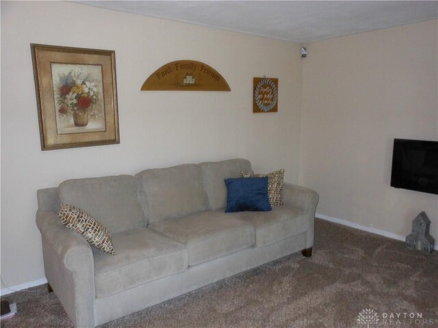 8189 Oakes Rd, Arcanum, OH 45304 - carpeted living room with baseboards