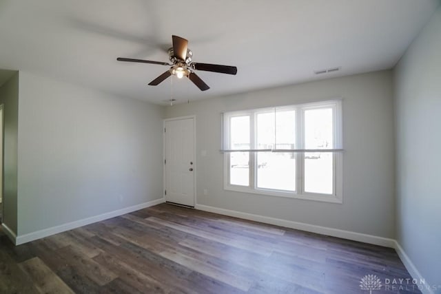 9738 Gibralter Dr, Colerain Township, OH 45251 - unfurnished room with baseboards, dark wood-type flooring, and a ceiling fan