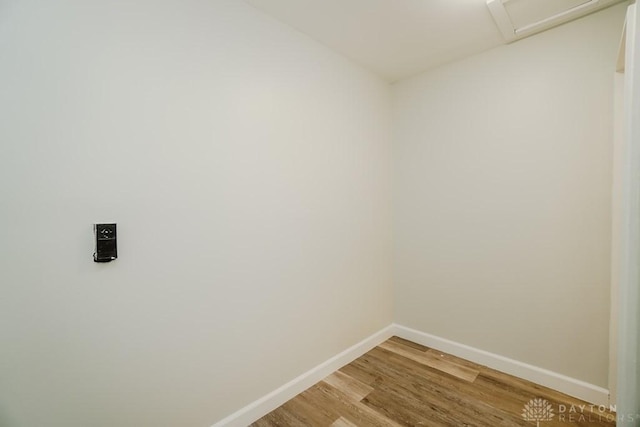9738 Gibralter Dr, Colerain Township, OH 45251 - empty room featuring baseboards, light wood finished floors, and attic access