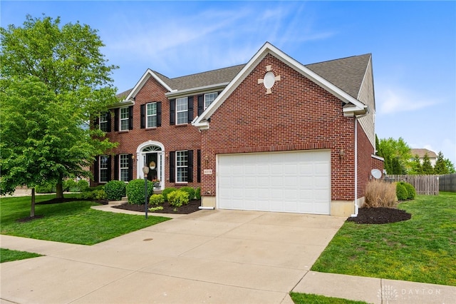 9378 Oak Brook Dr, Clearcreek Twp, OH 45458 - colonial-style house with brick siding and concrete driveway