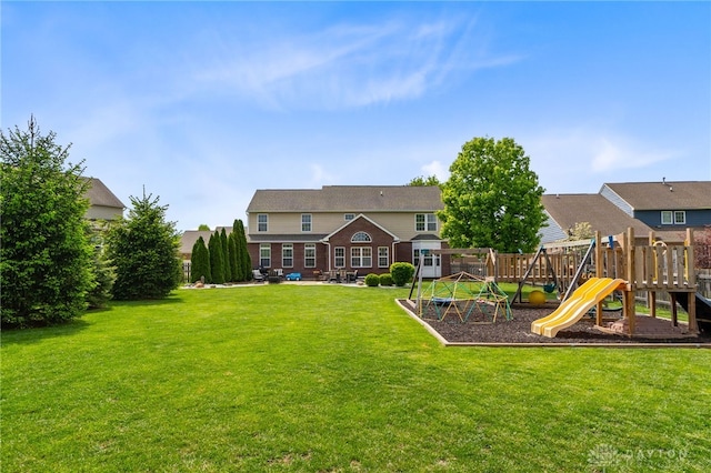9378 Oak Brook Dr, Clearcreek Twp, OH 45458 - back of house featuring a playground and a patio