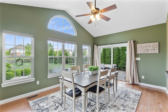9378 Oak Brook Dr, Clearcreek Twp, OH 45458 - dining space with a ceiling fan, baseboards, light wood-style flooring, and high vaulted ceiling