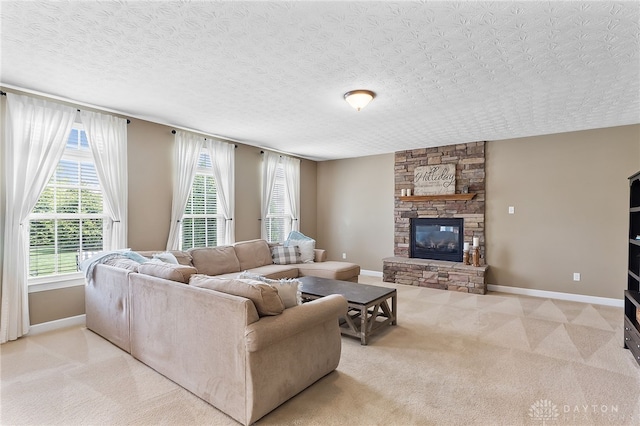 9378 Oak Brook Dr, Clearcreek Twp, OH 45458 - carpeted living area featuring a stone fireplace and baseboards