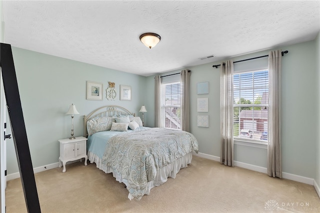 9378 Oak Brook Dr, Clearcreek Twp, OH 45458 - bedroom with light carpet, baseboards, and a textured ceiling