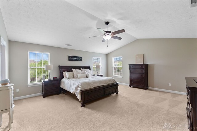 9378 Oak Brook Dr, Clearcreek Twp, OH 45458 - bedroom with baseboards, light colored carpet, multiple windows, vaulted ceiling, and a ceiling fan