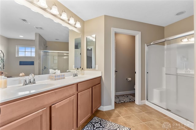 9378 Oak Brook Dr, Clearcreek Twp, OH 45458 - bathroom with a shower stall, tile patterned flooring, double vanity, toilet, and baseboards