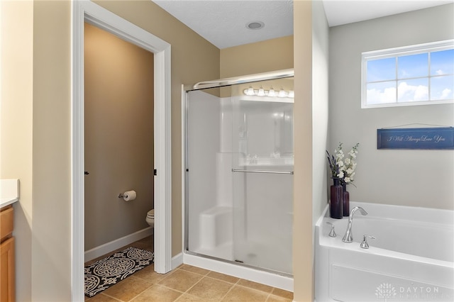 9378 Oak Brook Dr, Clearcreek Twp, OH 45458 - full bathroom with a shower stall, vanity, toilet, a garden tub, and baseboards
